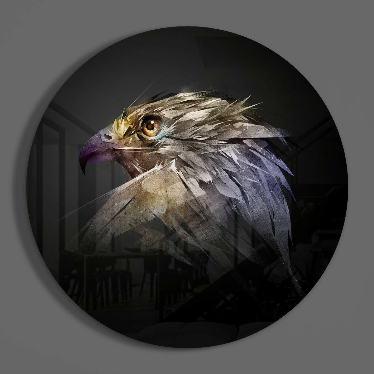 Shattered falcon head round glass wall art on a plain gray wall, glossy glass disc seen from the front