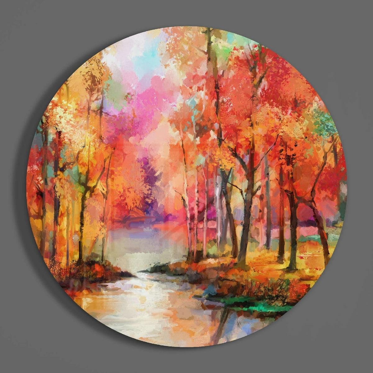 Autumn forest round glass wall art hanging on a plain gray wall