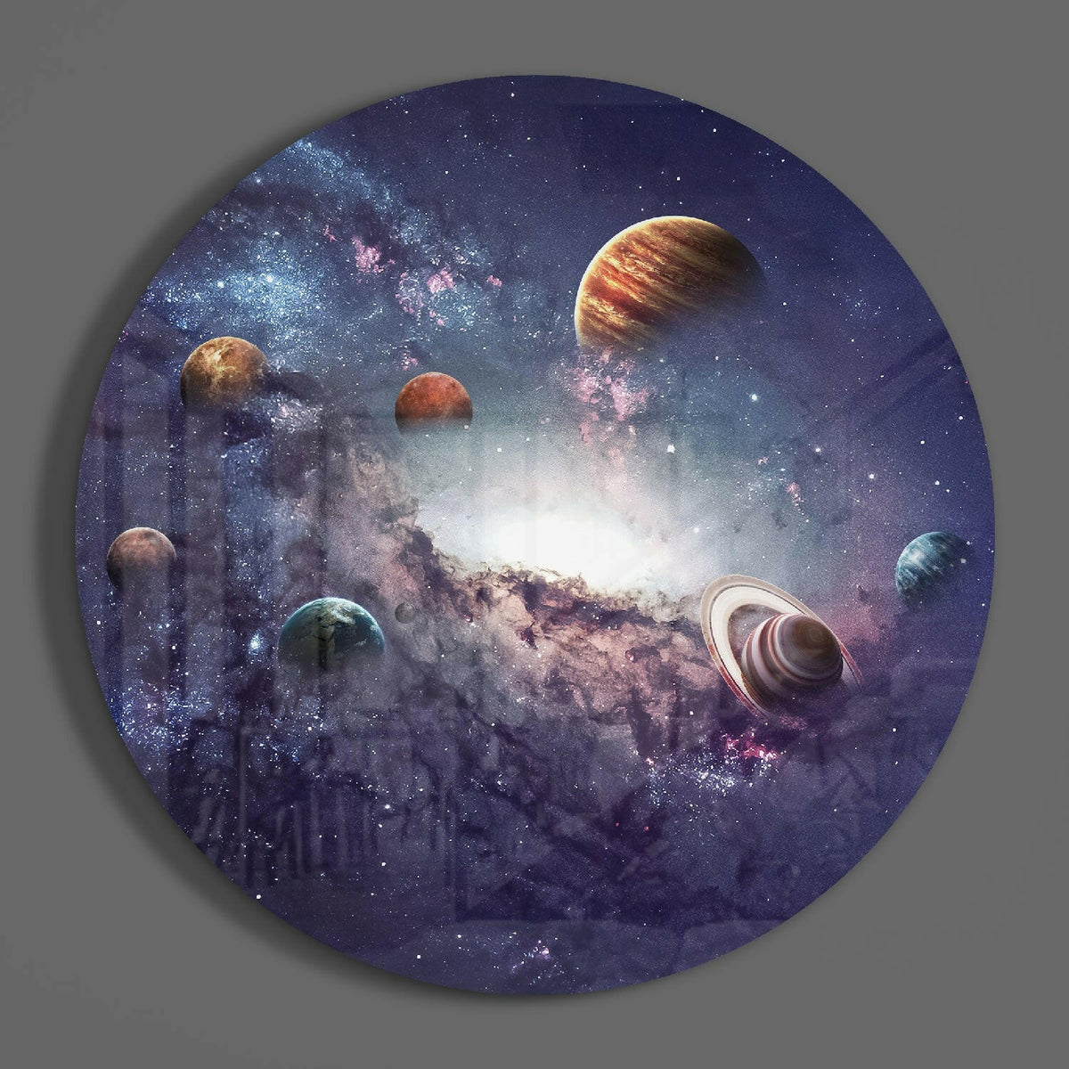 Solar system planets round glass wall art on a plain gray wall, glossy glass disc seen from the front