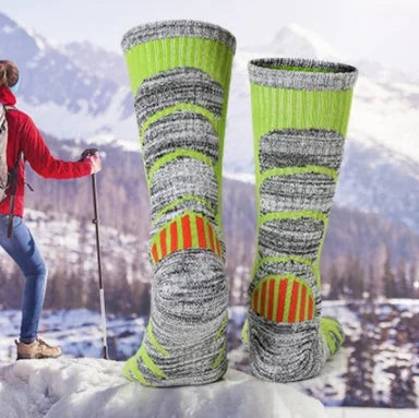 Ski socks shown from rear during mountain trekking highlighting padded heel support