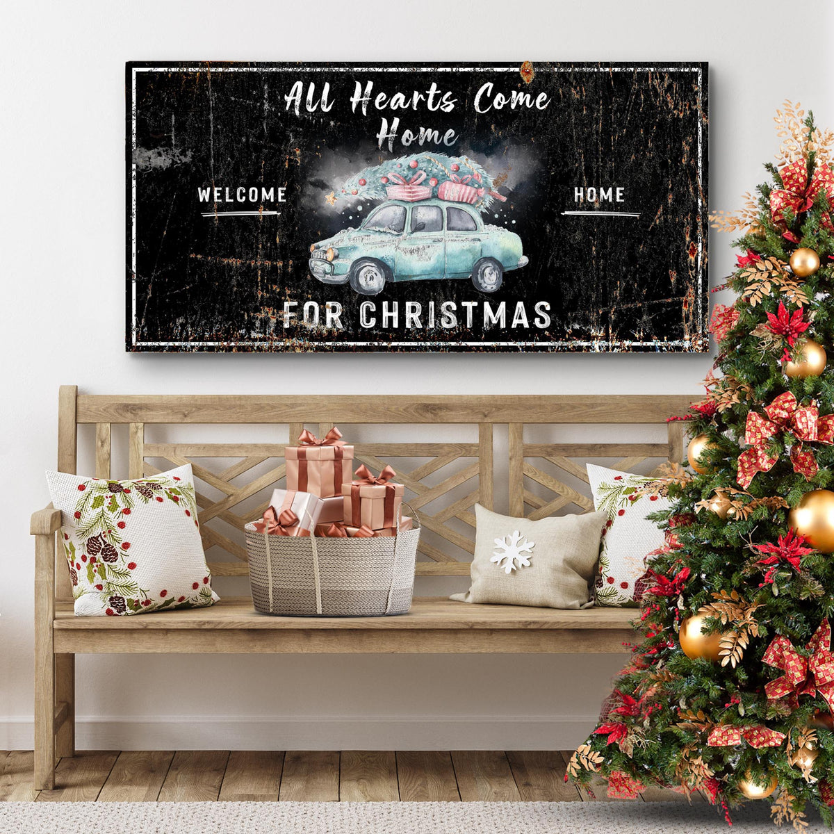 Second style of the Christmas sign in black with a pale blue car carrying a tree, above a bench beside a decorated tree