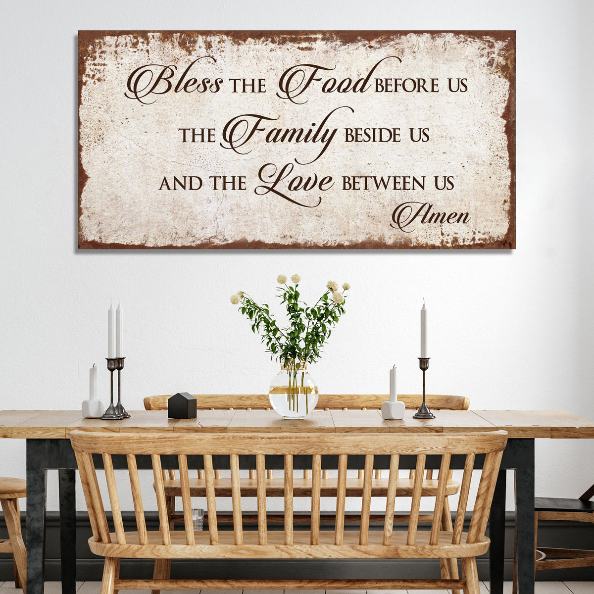 Style 3 of the Bless the Food canvas sign with a rust brown distressed-look edge above a dining bench