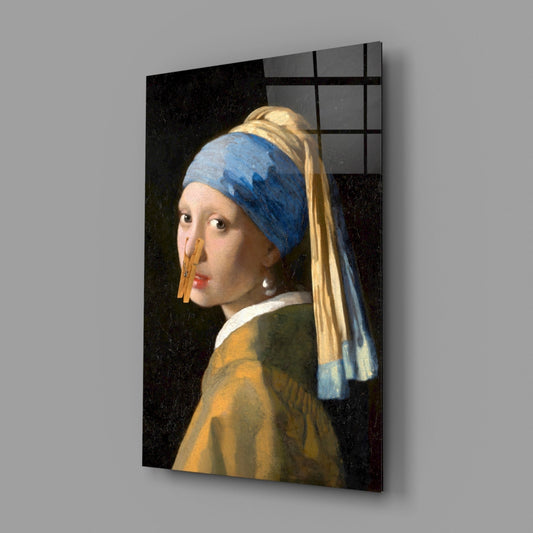 Pearl earring girl with clothespin glass wall art on a gray wall with a window reflection across the glossy glass
