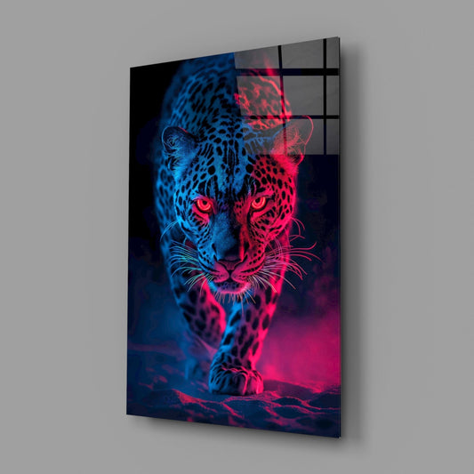 Neon blue and pink leopard glass wall art angled on a plain gray wall