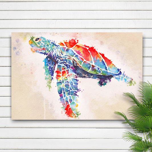 Rainbow watercolor-look sea turtle canvas on a white shiplap wall beside a green plant, close view
