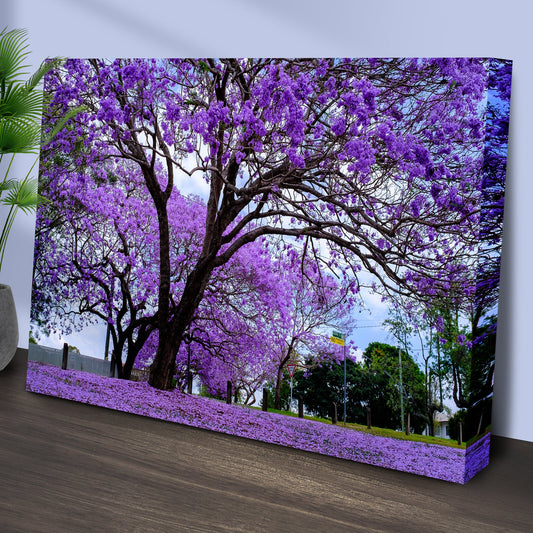 Purple jacaranda trees canvas leaning at an angle on a wood floor
