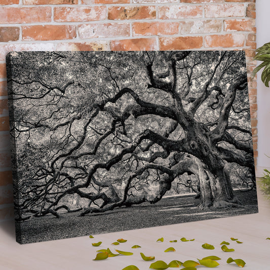 Sprawling oak tree canvas leaning at an angle against a red brick wall