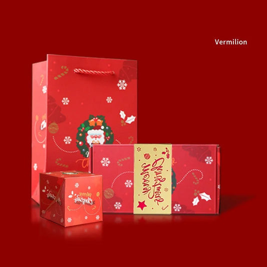 Vibrant Christmas gift bag and box set featuring Santa wreath artwork in a bright festive theme