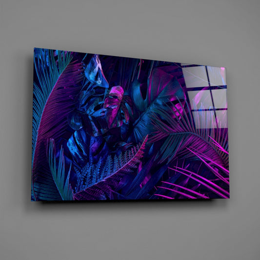 Neon jungle leaves glass wall art on a gray wall, light reflecting off the glossy front