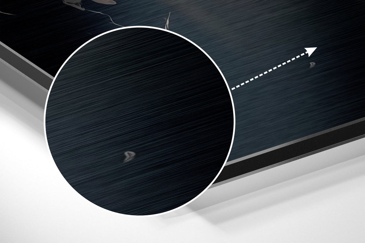 Magnified detail of the brushed metal grain showing through the backlit elephant print