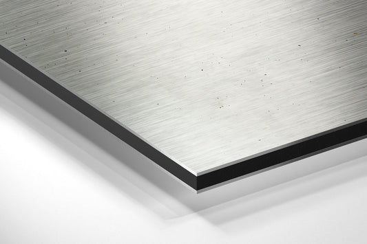 Orange band drip Get Sh*t Done brushed aluminum panel corner close-up showing the brushed metal grain