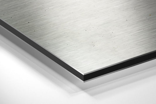 Amber drip two-tone Get Sh*t Done brushed aluminum panel corner close-up showing the brushed metal grain