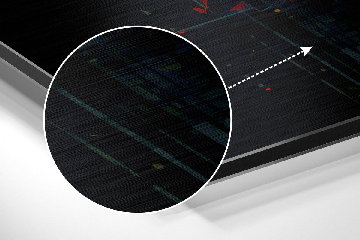 Magnified detail of the brushed metal grain showing through the glitch face print