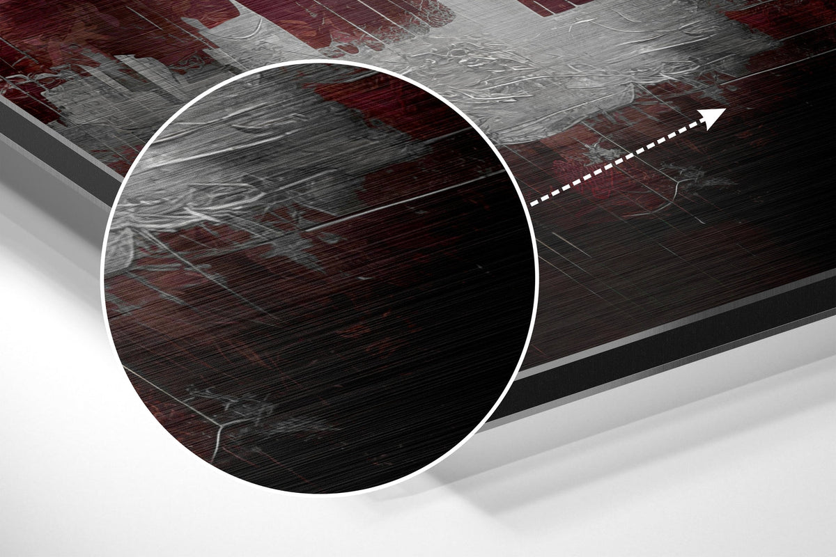 Magnified detail of the brushed metal grain showing through the crimson sky city skyline print