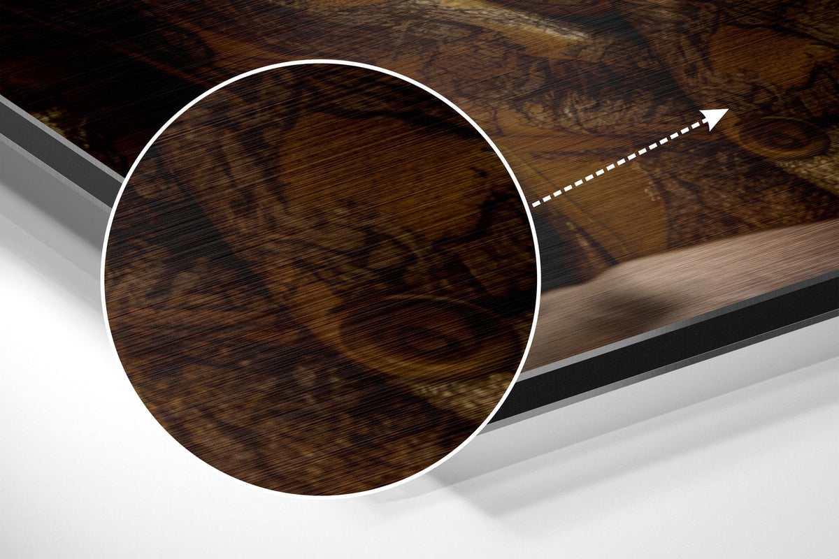 Magnified detail of the brushed metal grain showing through the lion in gold patterned suit print