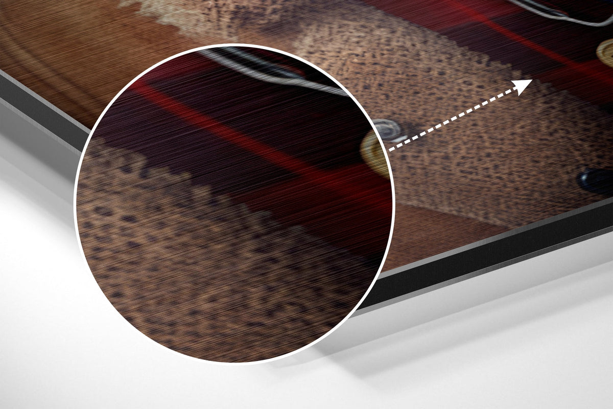 Magnified detail of the brushed metal grain showing through the dog in newsboy cap print