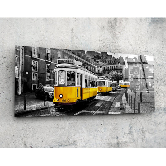 Yellow tram on a black and white Lisbon street, panoramic glass wall art on a concrete wall