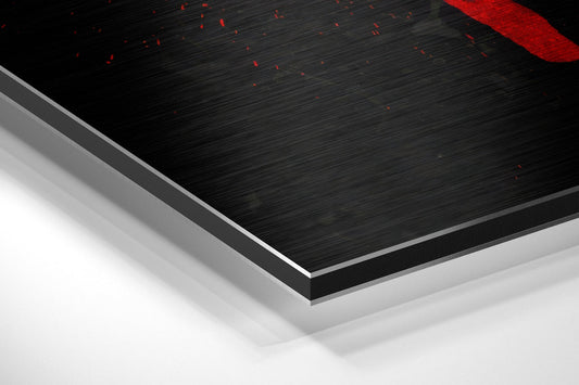 No pain no gain red dumbbell emblem brushed aluminum panel corner close-up showing the brushed metal grain