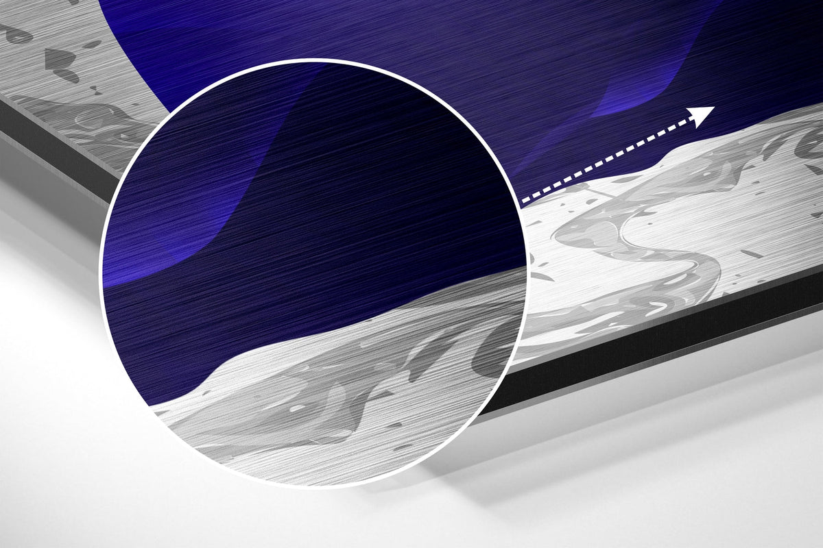 Magnified detail of the brushed metal grain showing through the navy petals and gold feather print