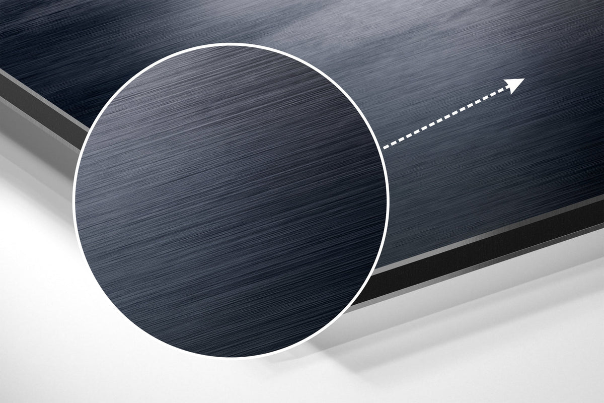 Magnified detail of the brushed metal grain showing through the black and white city skyline by the river print