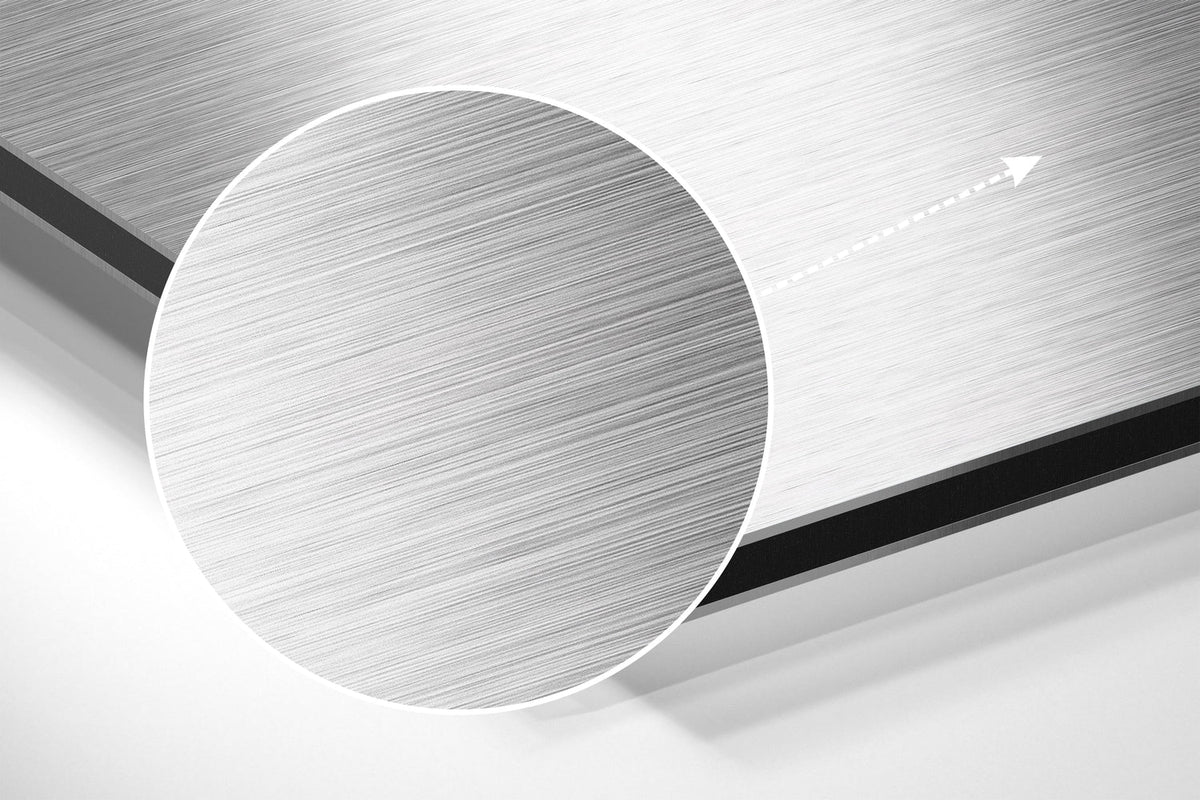 Magnified detail of the brushed metal grain showing through the elephant head sketch print