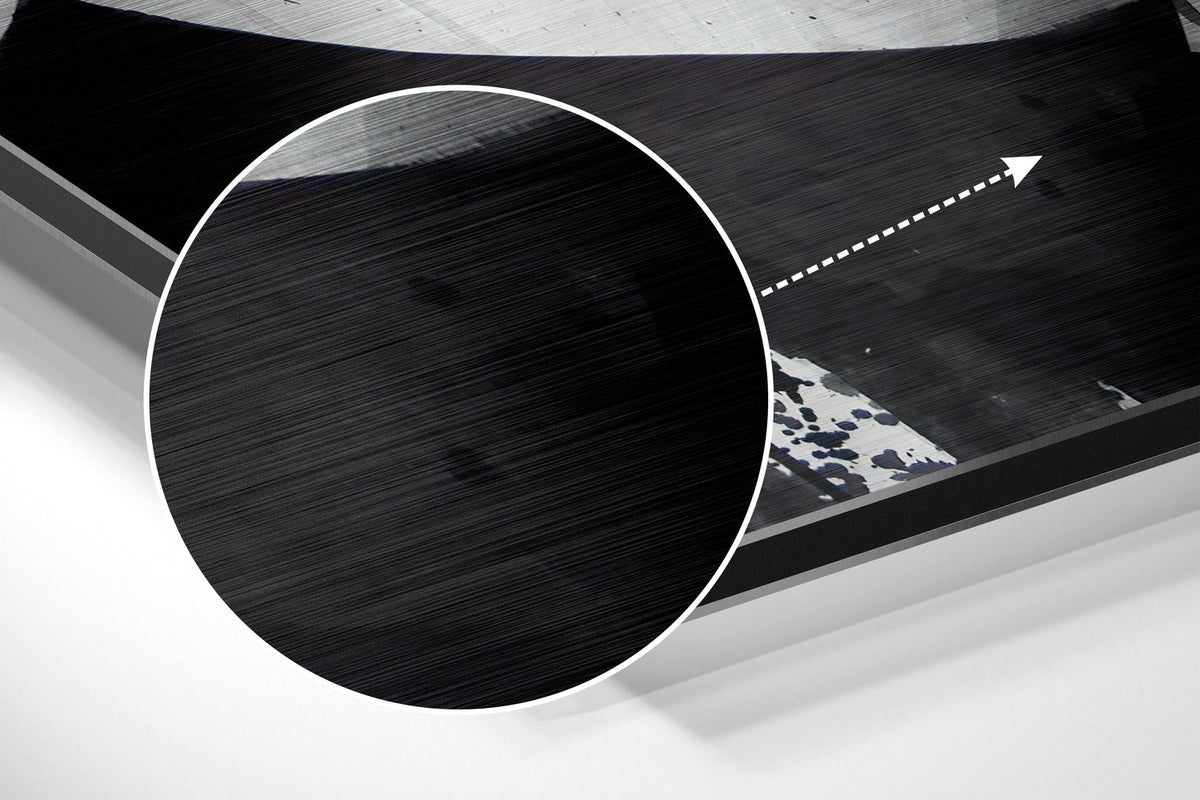 Magnified detail of the brushed metal grain showing through the blue paint blot woman sketch print