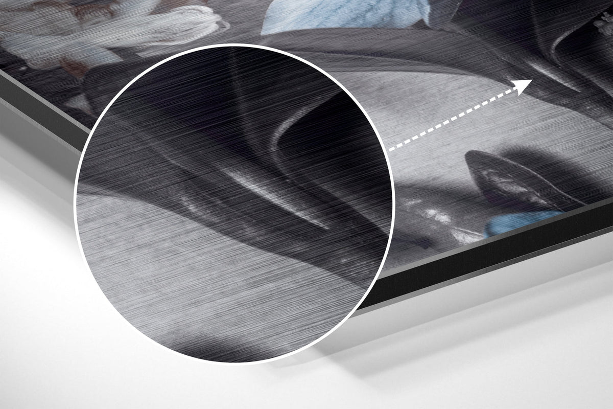 Magnified detail of the brushed metal grain showing through the steel blue blooms print