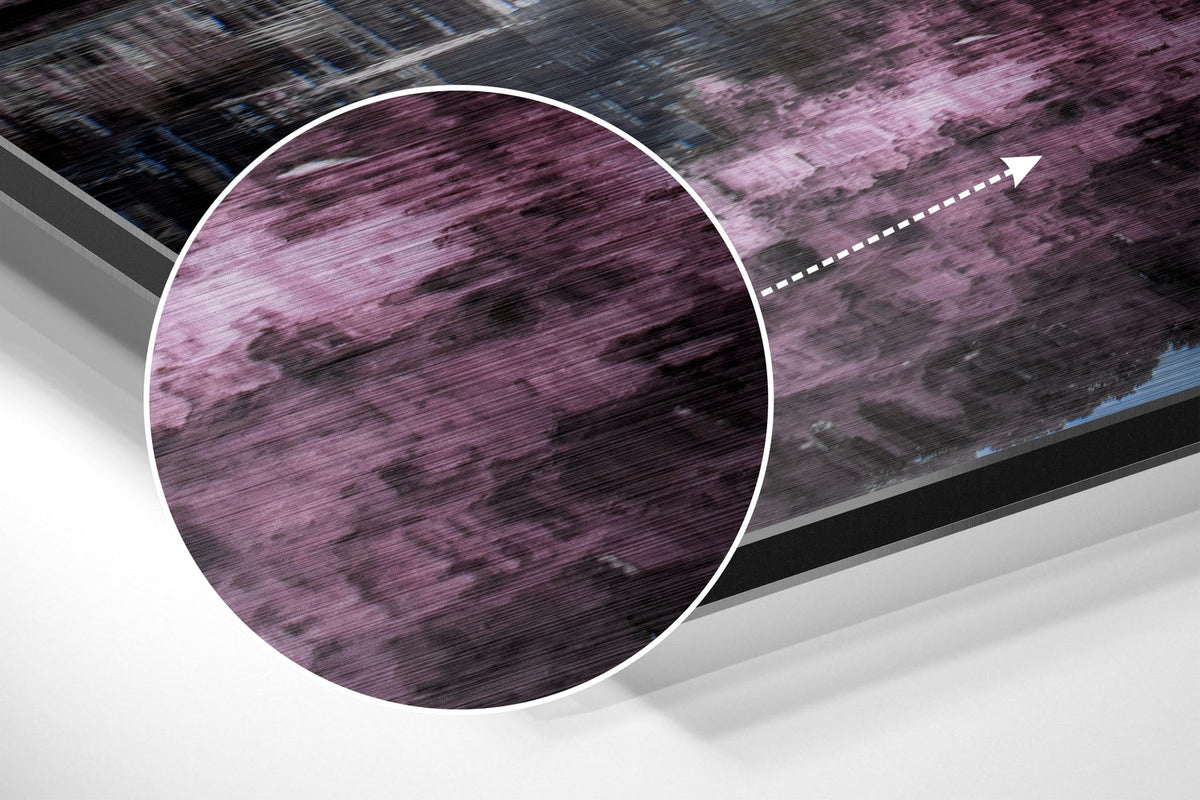 Magnified detail of the brushed metal grain showing through the pink blossom canal print