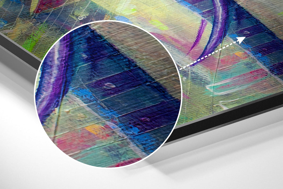 Magnified detail of the brushed metal grain showing through the abstract patchwork elephant print