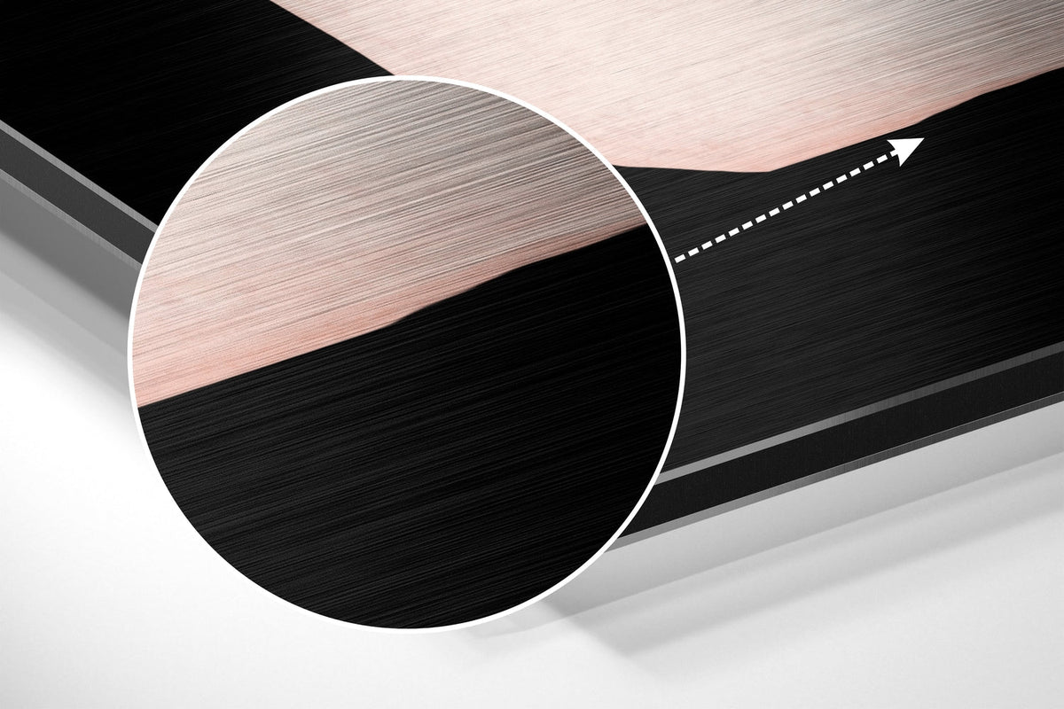 Magnified detail of the brushed metal grain showing through the black wavy line print