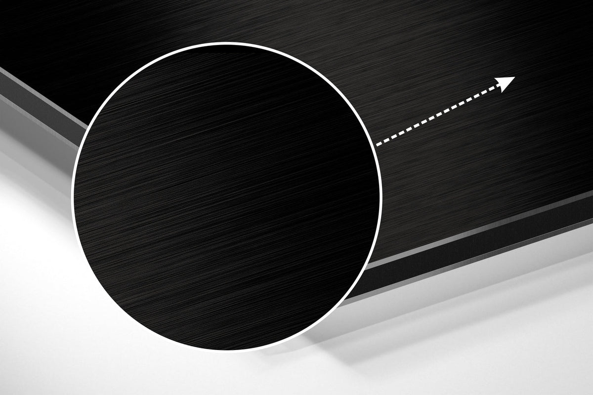 Magnified detail of the brushed metal grain showing through the orange smoke swirls on black print