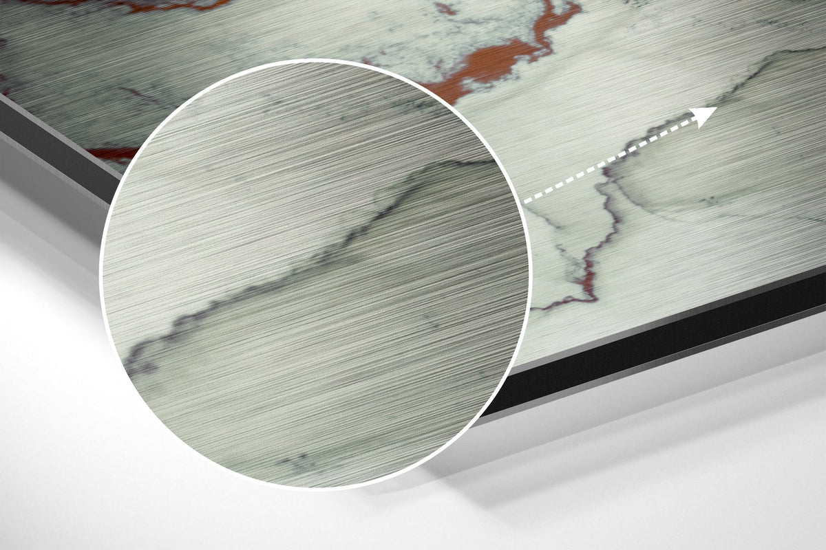 Magnified detail of the brushed metal grain showing through the blush pink and sage watercolor marble print