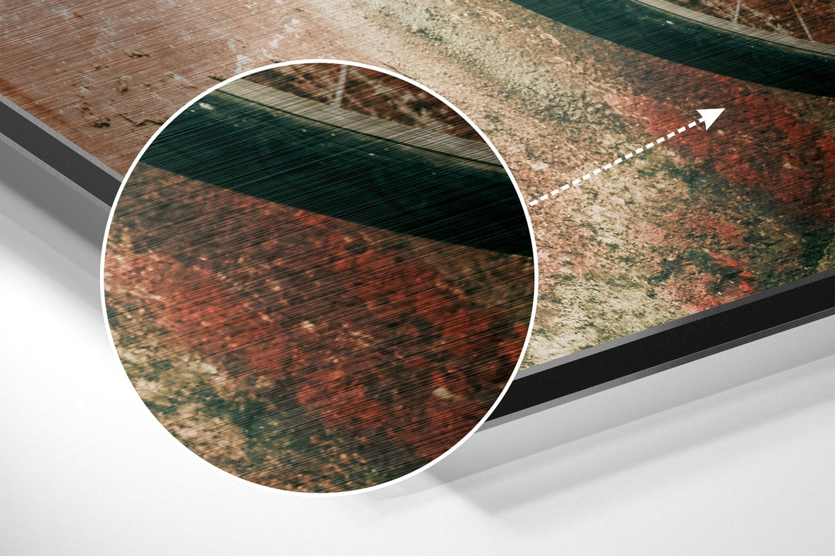 Magnified detail of the brushed metal grain showing through the blue bicycle print