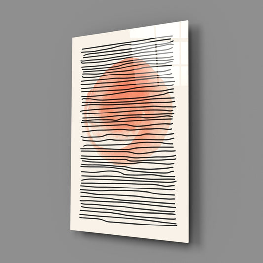 Coral sun and black line abstract glass wall art on a gray wall