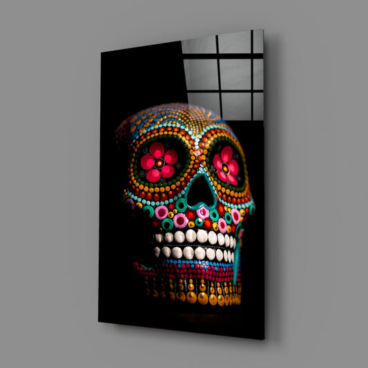 Rainbow dotted sugar skull glass wall art on a gray wall with a glossy reflection