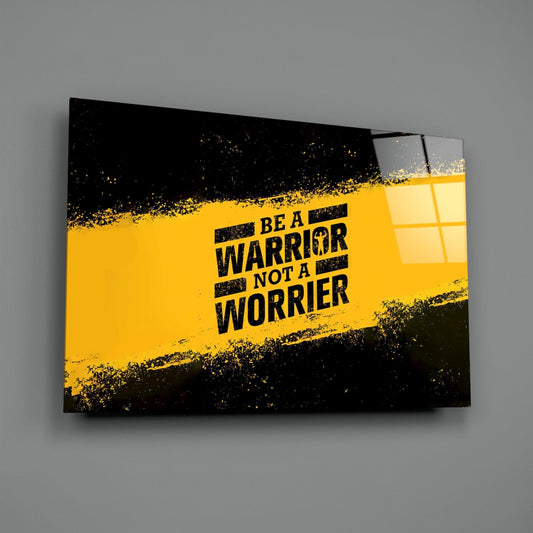 Be a warrior yellow stencil glass wall art on a gray wall with a window reflection in the glossy front