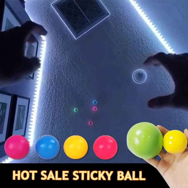 child tossing sticky wall balls that glow