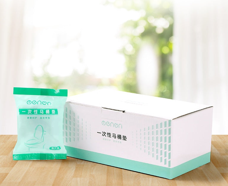 Box and single packets of sanitary toilet seat covers for travel