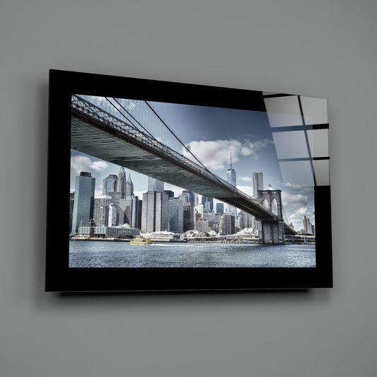 Brooklyn Bridge and Manhattan skyline glass wall art with a black border on a gray wall