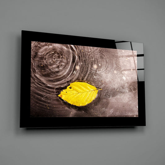 Yellow leaf glass wall art on a plain gray wall