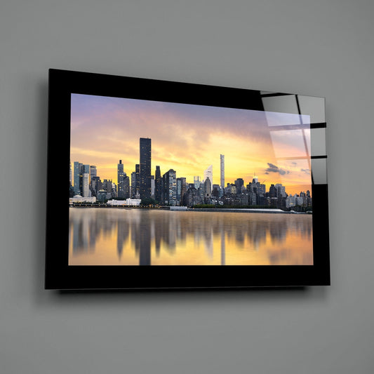 New York skyline sunset glass wall art with a black border on a gray wall