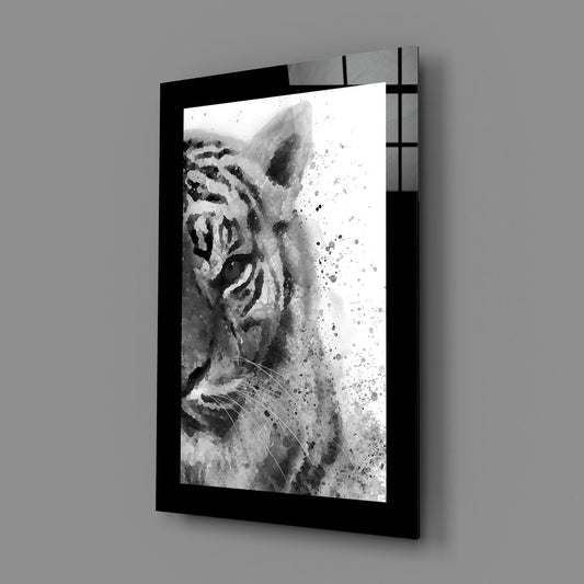 Black and white watercolor tiger glass wall art on a plain gray wall