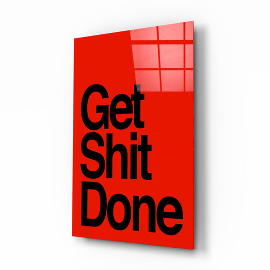 Get Sh*t Done bold black on red glass wall art on a white background, shown at a slight angle