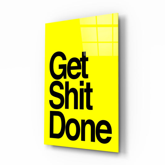 Get Sh*t Done bold black on yellow glass wall art on a white background, shown at a slight angle