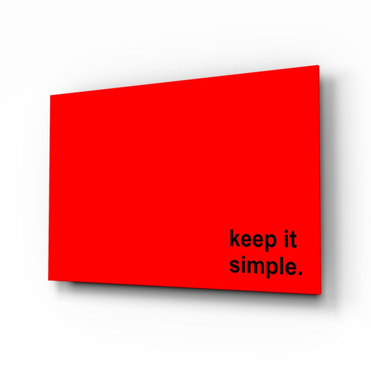 Keep it simple black text on red glass wall art on a white background, shown at a slight angle