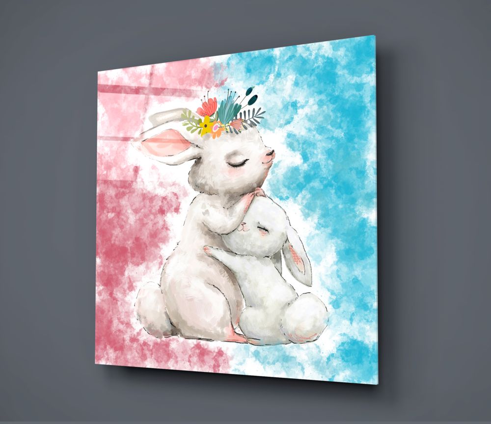 Mother and baby bunny glass wall art on a dark gray wall, light reflecting off the glossy front