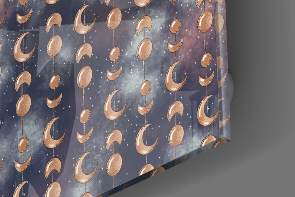 Close-up of the glossy tempered glass edge of the gold moon phases pattern piece