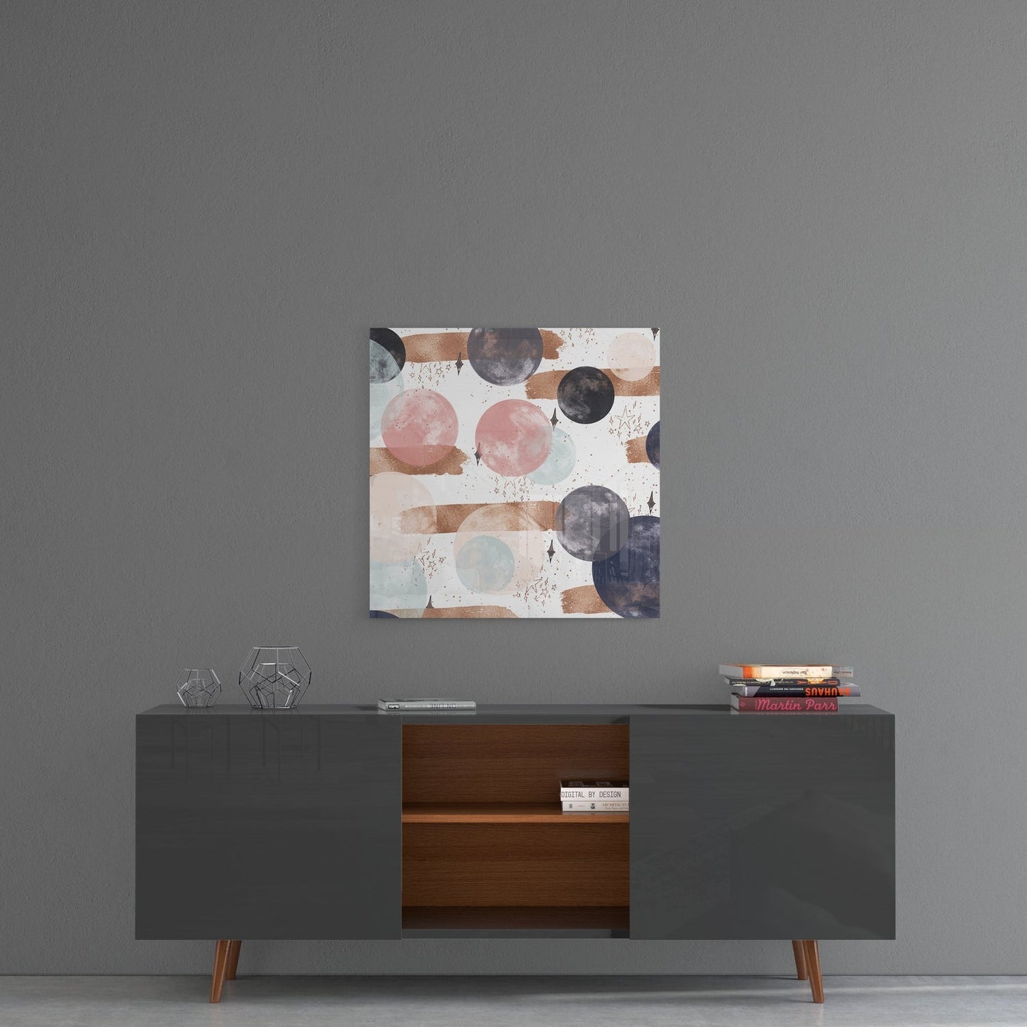 Pink and navy circles abstract glass wall art on a gray wall above a gray sideboard with a wooden center