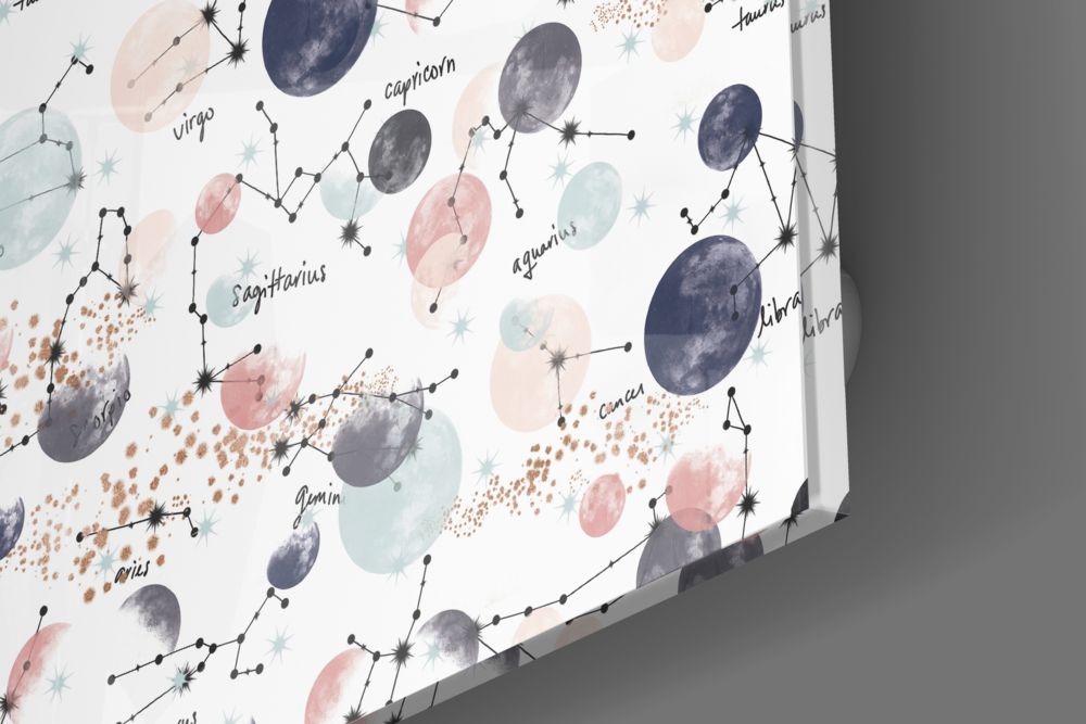 Close-up of the glossy tempered glass corner of the zodiac constellations and moons pattern