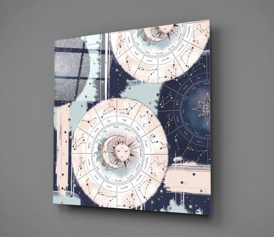 Zodiac wheel sun and moon glass wall art at an angle against a gray background